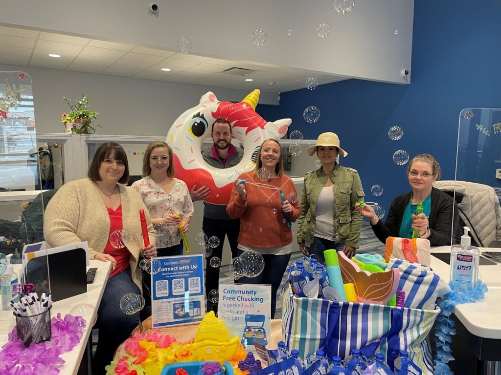 Image of Community First Bank employees at the Oak Ridge branch with a fun display