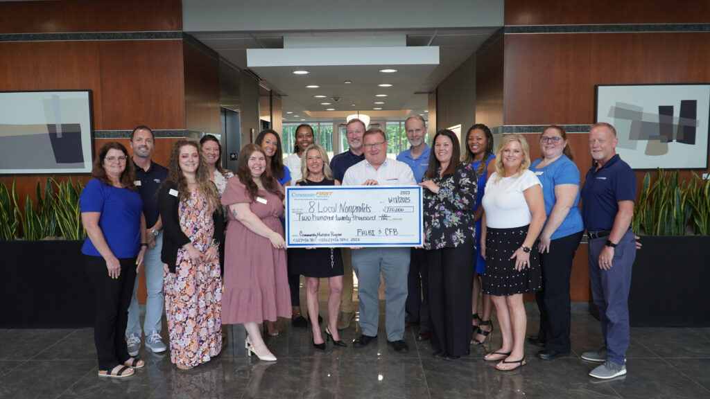 Community First Bank team celebrates Community Multiplier Grant Program, benefiting 8 local nonprofits.